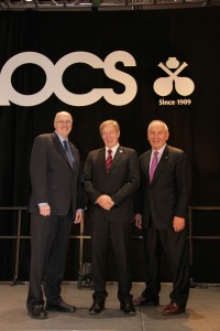 Photo: AOCS. Miller on stage at the 2014 American Oil Chemists’ Society meeting in Texas, with AOCS technical director Richard Cantrill and fellow Australian Rod Mailer. 
